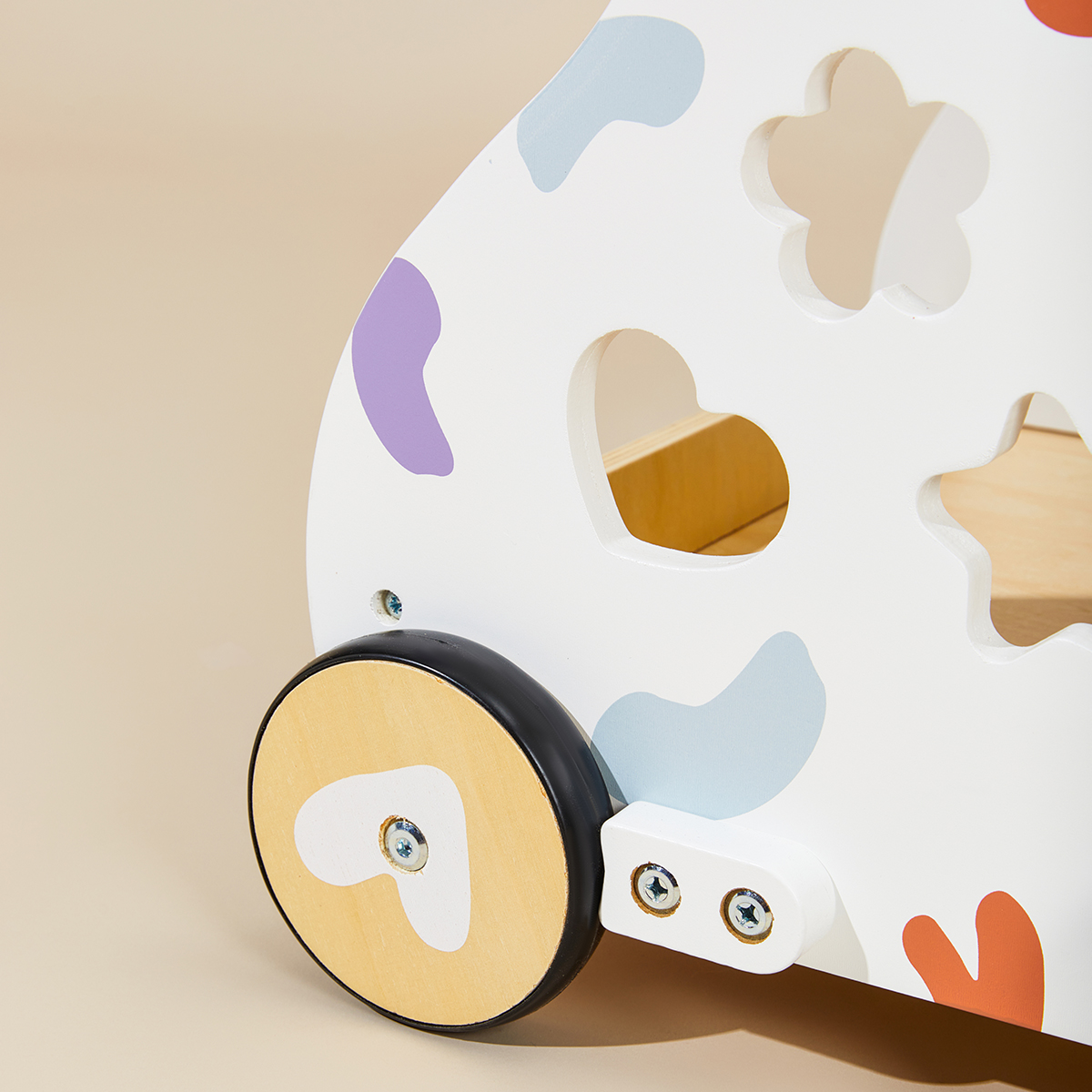 Close-up of baby activity walker wheel and side shape sorter